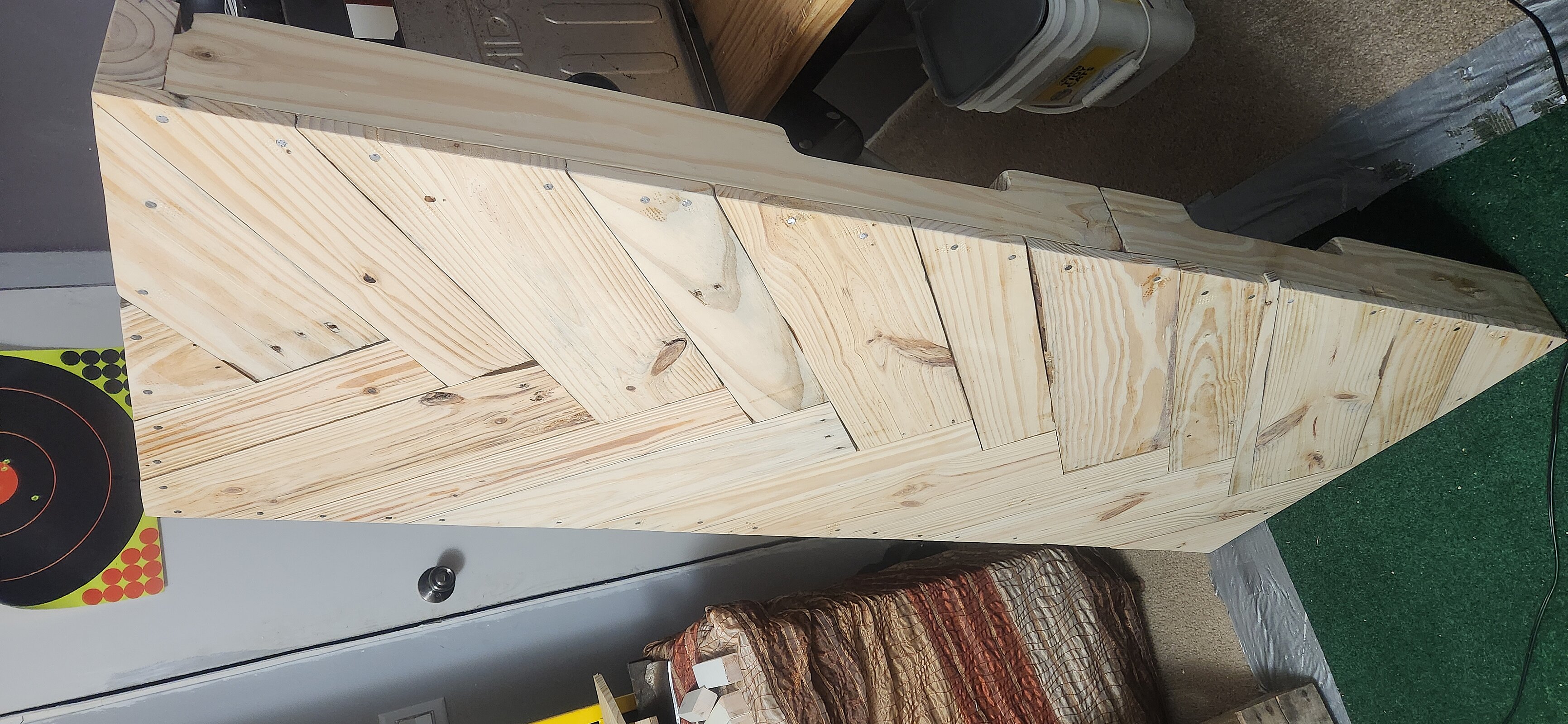 Laying out angle-cut wood boards in a geometric herringbone pattern