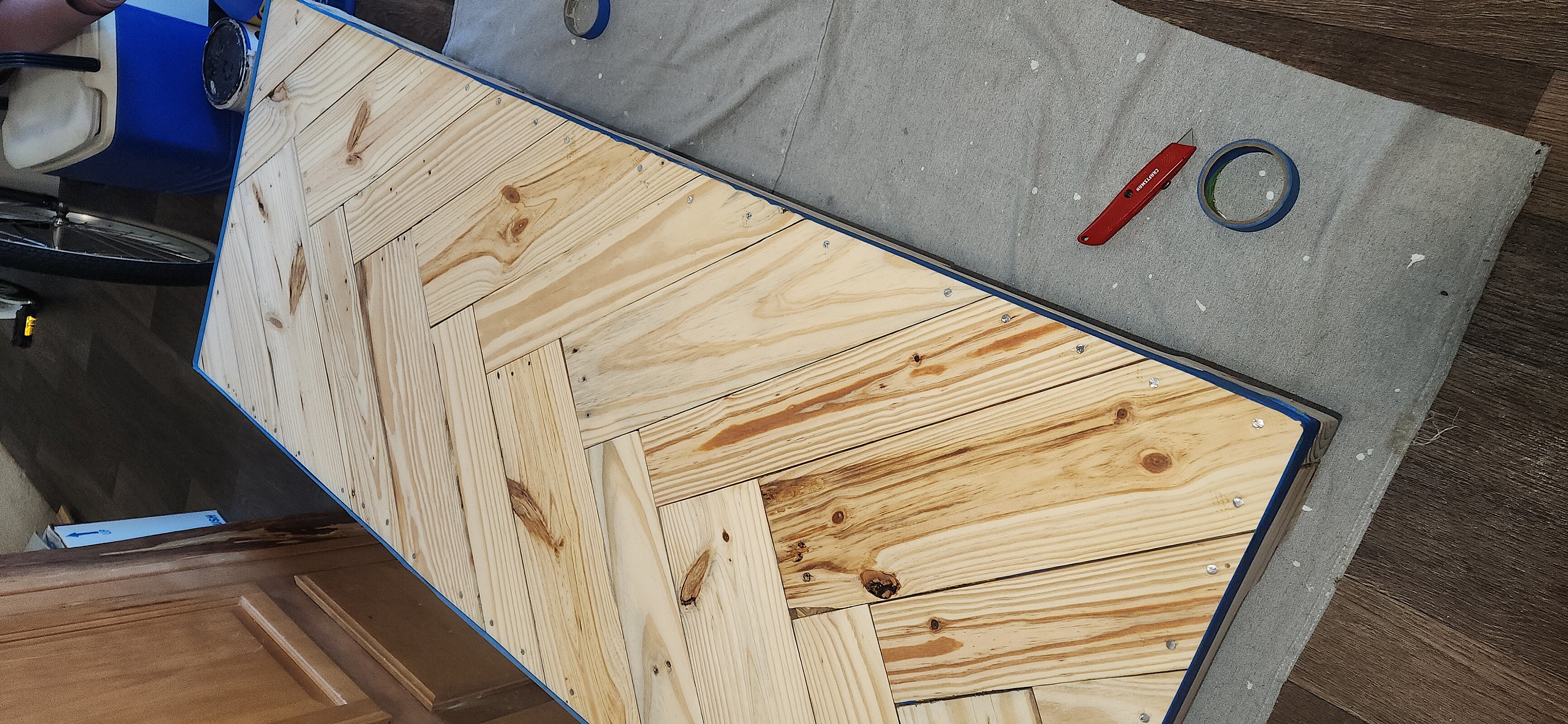 Applying rich wood stain to highlight natural grain patterns