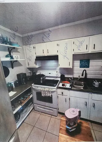 Original kitchen cabinets and appliances before the 1942 home remodel