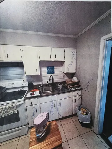 Original kitchen sink and cabinets before the 1942 home remodel