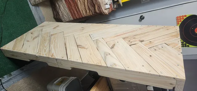Laying out angle-cut wood boards in a geometric herringbone pattern